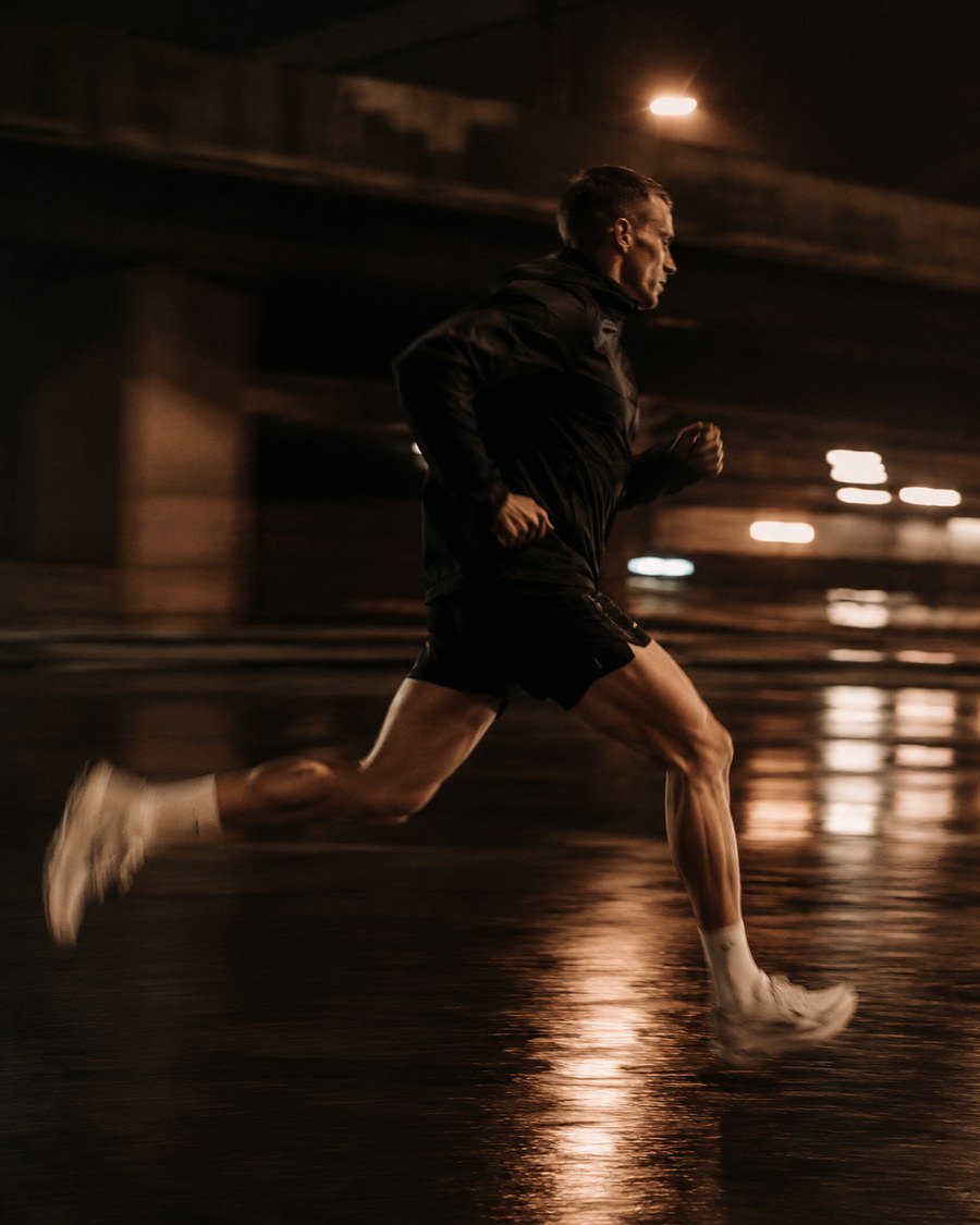 Runner training outdoors at night